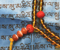 Chapelet tibétain traditionnel en perles de verre jaune – Perles lotus rouges La Magie du Bouddha.