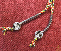 Chapelet Tibétain mala en oeil de tigre. La Magie du Bouddha.