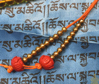 Chapelet tibétain traditionnel en perles de verre jaune – Perles lotus rouges La Magie du Bouddha.
