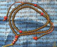 Chapelet tibétain traditionnel en perles de verre jaune – Perles lotus rouges La Magie du Bouddha.