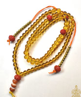 Chapelet tibétain traditionnel en perles de verre jaune – Perles lotus rouges La Magie du Bouddha.