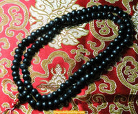 Chapelets Bouddhistes Mala Tibétain en bois - couleurs variées. La Magie du Bouddha.