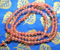 Chapelet Tibétain en quartz rose. La Magie du Bouddha.