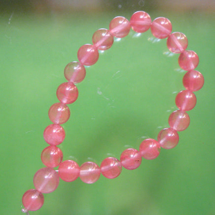Chapelet Bouddhiste de poignet en quartz strawberry. magiedubouddha