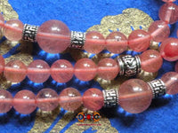 Chapelet Tibétain en quartz rose. La Magie du Bouddha.