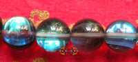 Chapelet de poignet Bouddhiste en verre bleu opalisé. magiedubouddha