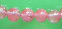 Chapelet Bouddhiste de poignet en quartz strawberry. magiedubouddha
