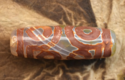 Perle sacrée tibétaine Dzi translucide à sept yeux La Magie du Bouddha.