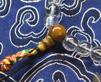 Chapelet Mala Tibétain en Cristal Spatika – Ornements Tigre et Dorje La Magie du Bouddha.