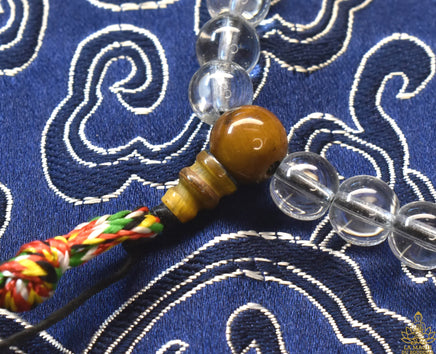 Chapelet Mala Tibétain en Cristal Spatika – Ornements Tigre et Dorje La Magie du Bouddha.