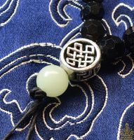 Chapelet tibétain mala noir avec Ye Ming Zhu et compteurs jaspe La Magie du Bouddha.