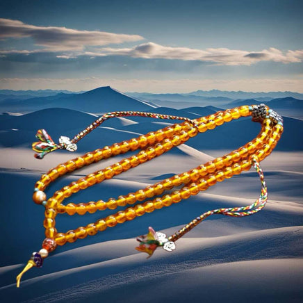 Chapelet Tibétain Mala – Perles mantra de Chenrezi en verre jaune La Magie du Bouddha.
