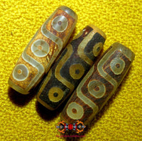Small sacred Tibetan Dzi beads with nine eyes.