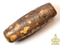 Perle sacrée tibétaine Dzi à neuf yeux en agate ancienne début XXe siècle La Magie du Bouddha.