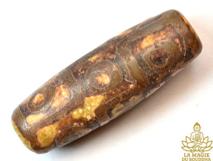Perle sacrée tibétaine Dzi à neuf yeux en agate ancienne début XXe siècle La Magie du Bouddha.