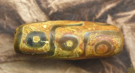 Perle Sacrée Tibétaine Dzi à Neuf Yeux – Longévité, Karma et Pouvoir Spirituel La Magie du Bouddha.