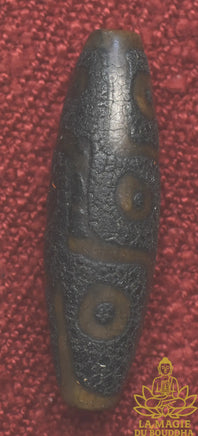 Perle sacrée tibétaine Dzi à neuf yeux ancienne patinée sombre La Magie du Bouddha.