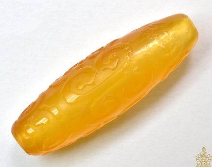 Perle sacrée tibétaine jaune sculptée – idéale pour mala de Jambhalla La Magie du Bouddha.