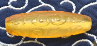 Perle sacrée tibétaine jaune sculptée – idéale pour mala de Jambhalla La Magie du Bouddha.
