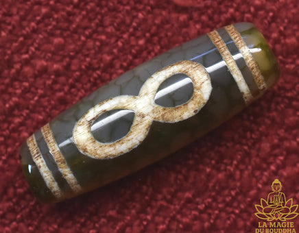 Perle sacrée tibétaine Dzi artisanale au symbole de l’infini La Magie du Bouddha.