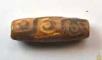 Perle sacrée tibétaine Dzi à neuf yeux – Talisman de prospérité et de pouvoir spirituel