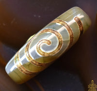 Perle sacrée tibétaine Dzi en agate – Motif spirale (évolution et énergie vitale) La Magie du Bouddha.