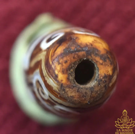 Perle Dzi tibétaine Svastika Tradition Bönpo en agate La Magie du Bouddha.