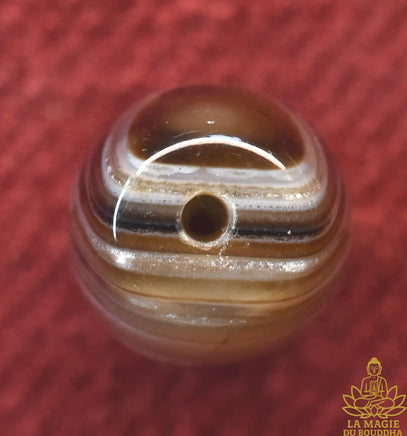 Perle Dzi en agate tibétaine rayée naturelle La Magie du Bouddha.