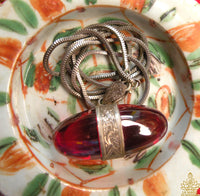 Pendentif unique Shiva Lingam en cristal rouge des Nāgas – Monture argent