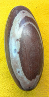 Shiva Lingam sacred stone from the Narmada River with marbled patterns
