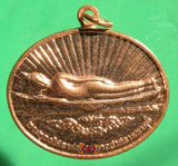 Médaille thai du bouddha couché. 
