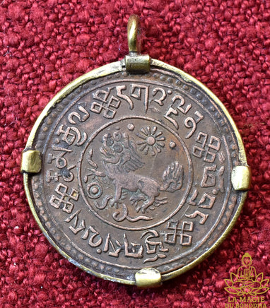 Pendentif pièce tibétaine ancienne de 1 Sho au Lion des Neiges La Magie du Bouddha.