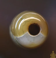 Perle sacrée tibétaine Dzi en agate – Motif spirale (évolution et énergie vitale) La Magie du Bouddha.