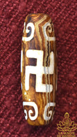 Perle Dzi tibétaine Svastika Tradition Bönpo en agate La Magie du Bouddha.