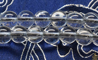 Chapelet Mala Tibétain en Cristal Spatika – Ornements Tigre et Dorje La Magie du Bouddha.