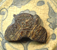 Amulettes protectrices Phra Rahu en coquille de noix de coco (Wat Sri Sathong)