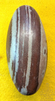 Shiva Lingam sacred stone from the Narmada River with marbled patterns