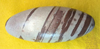 Sacred Shiva Lingam in natural stone with brown bands