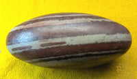 Shiva Lingam sacred stone from the Narmada River with marbled patterns