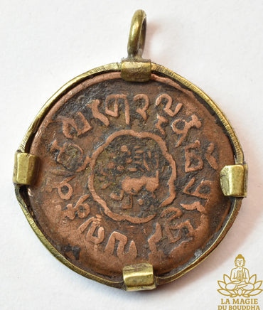 Ancienne monnaie tibétaine de 5 Skar montée en pendentif La Magie du Bouddha.