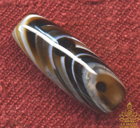 Perle Dzi en agate tibétaine rayée naturelle La Magie du Bouddha.