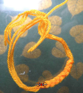 Bracelet bénit Saï Sin orange - Vénérable LP Sawae. La Magie du Bouddha.