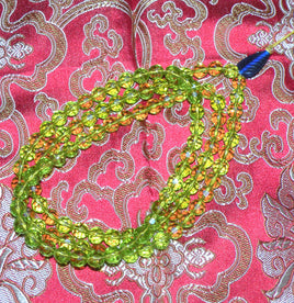 Chapelet Bouddhiste mala en perles de verre à facettes. magiedubouddha
