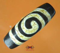 Dzi Tibétain avec motif en spirale. magiedubouddha