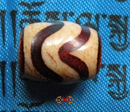Petit Dzi Tibétain avec motif à rayures. magiedubouddha