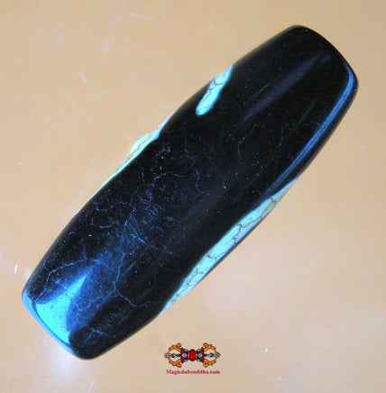 Dzi Tibétain avec motif en spirale. magiedubouddha