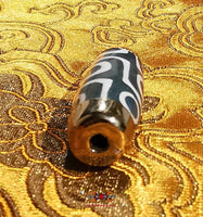 Beautiful green Tibetan Dzi beads with 9 eyes. 