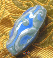 Perle tibétaine en céramique verte et bleue style Dzi. magiedubouddha.com