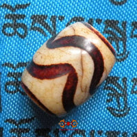 Petit Dzi Tibétain avec motif à rayures. magiedubouddha