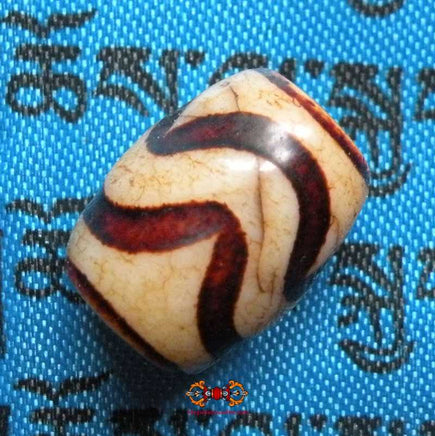 Petit Dzi Tibétain avec motif à rayures. magiedubouddha